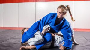 two women doing jiu jitsu