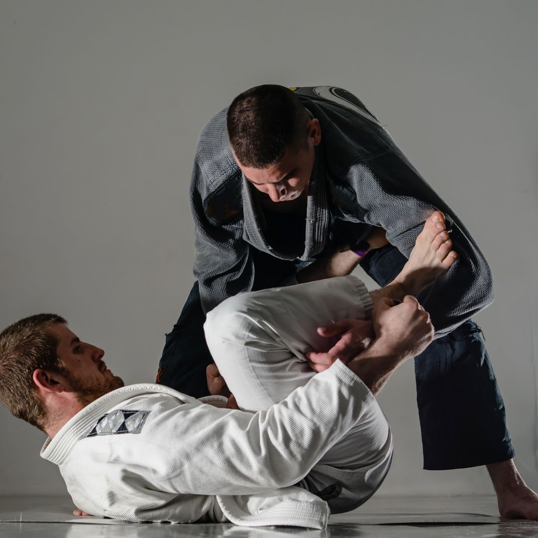 two men doing BJJ